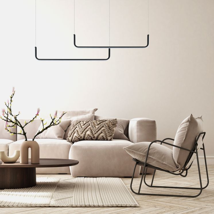 nowoczesna lampa wisząca malawi w salonie nad kanapą
