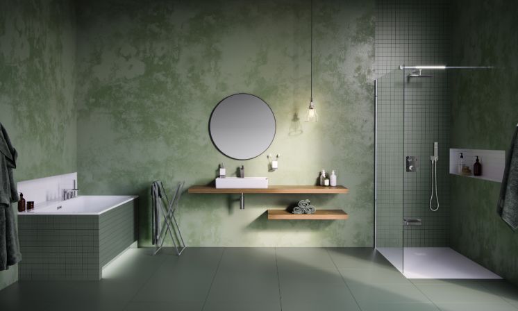 zielona łazienka z umywalką nablatową i ozdobnym syfonem